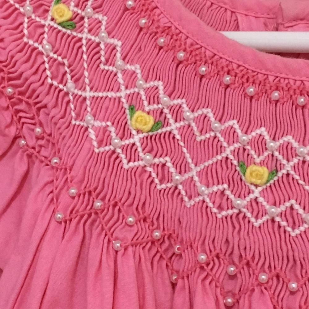 Pink dress smocked with yellow roses and pearls